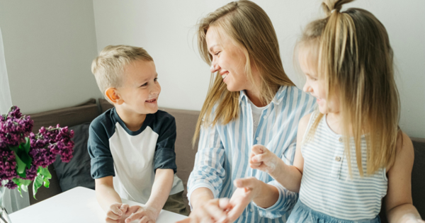 Mum And Two Children Baking