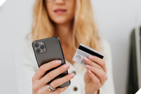 Lady Making Payment On Phone